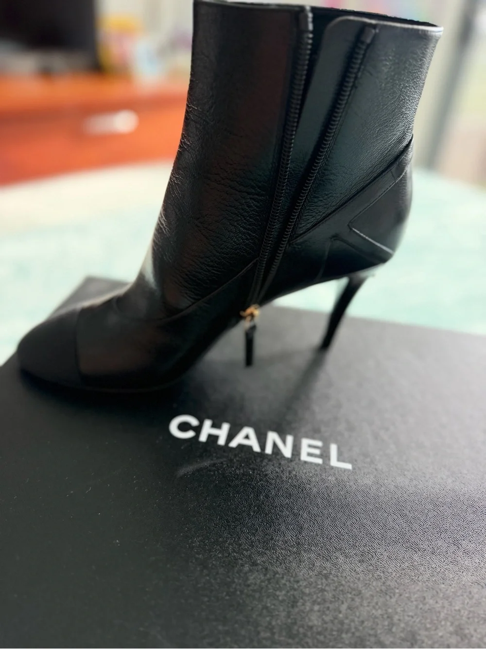 CHANEL Black Leather Ankle Booties with Black Cap Toe and Gold CC